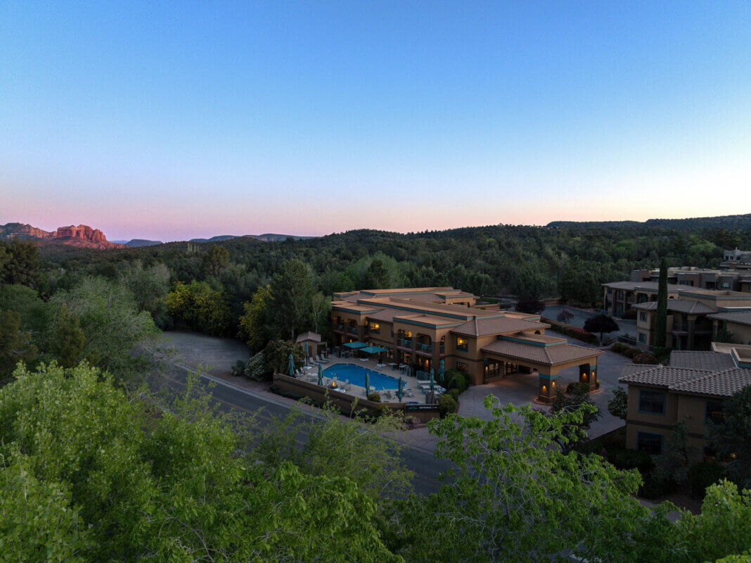 Aerial view wide shot of Mountain Modern Sedona at dusk