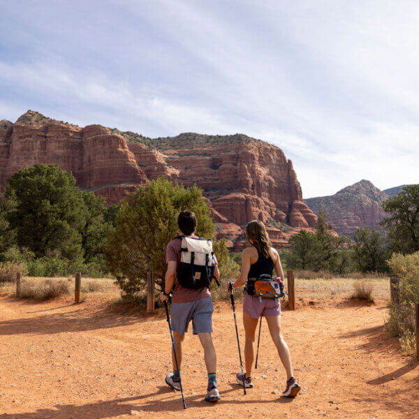 couple hiking on red rock trails